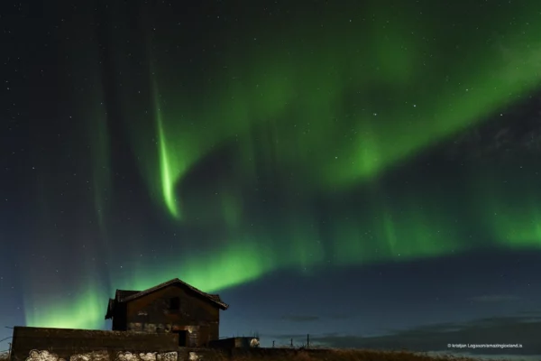 Northern lights over abandoned house in Vogar south Iceland
