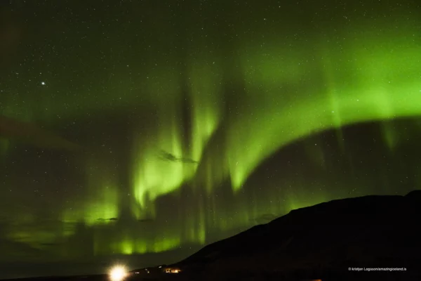Northern lights over bay of Hvalfjörður in Iceland