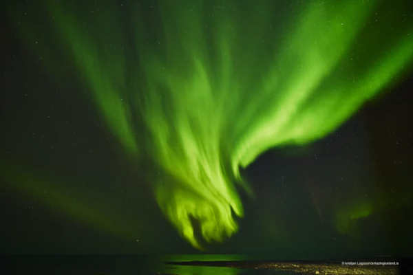 Aurora Borealis or Northern lights over atlantic ocean in Iceland